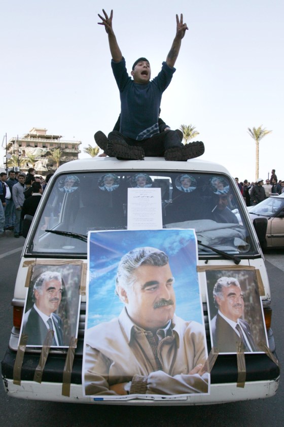 Supporters of slain former Prime Minister Rafik Hariri ride through the streets of Beirut on Tuesday.