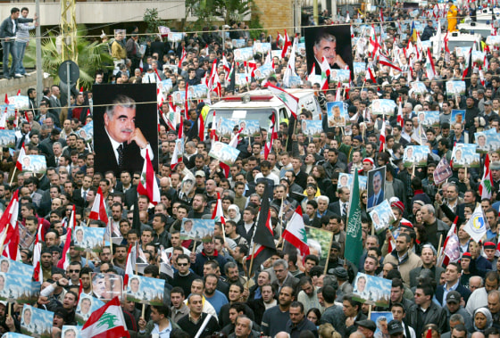 Thousands of supporters of former Lebanese Prime Minister Rafik Hariri take part in the funeral procession in Beirut on Wednesday.