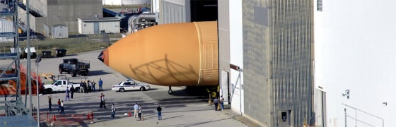 The shuttle's newly redesigned external tank disappears into the Vehicle Assembly Building at the Kennedy Space Center in Cape Canaveral, Fla, on Jan. 6.