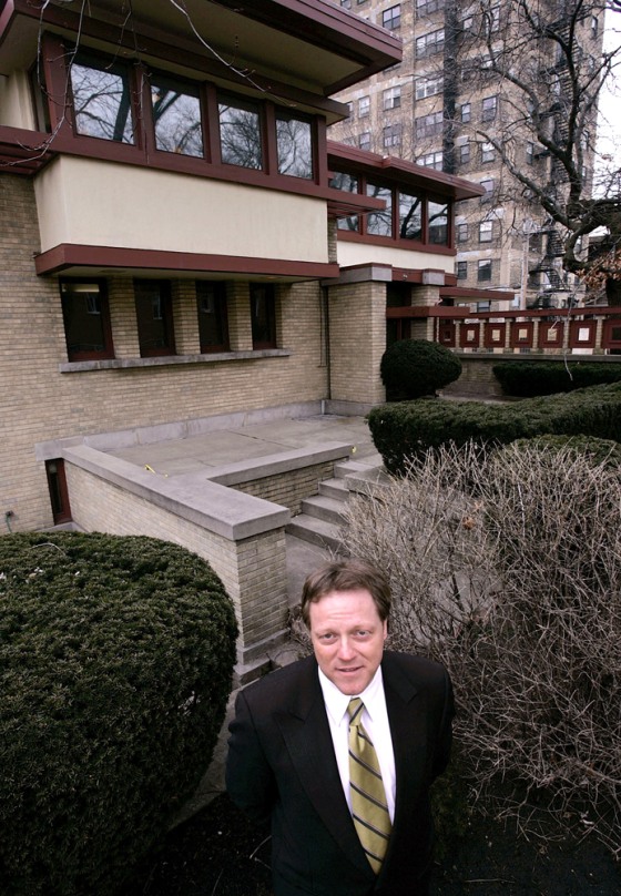 Frank Diliberto, whose company is handling the auction of the Emil Bach House, stands in front of the Prairie-style home designed by Frank Lloyd Wright.