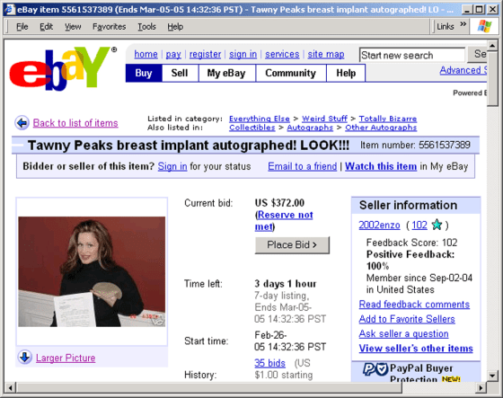 Tawny Peaks is shown here with one of her autographed breast implants in an ad on eBay.