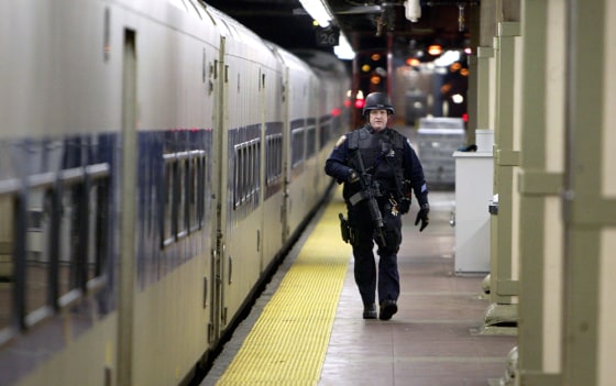 A heavily armed police officer patrols the tracks below Grand Central Station in New York City earlier this year.