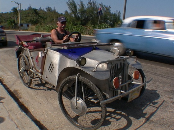 Juan Martinez Rangel drives his prized possession, a car assembled over a 20-year period with a pile of scrap metal and junkyard parts.