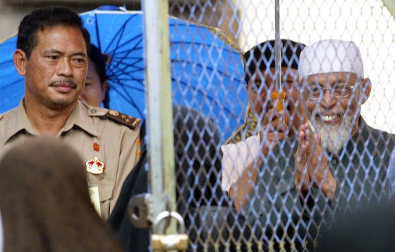 Indonesian Muslim cleric Abu Bakar Bashir greets his supporters at the Cipinang prison in Jakarta