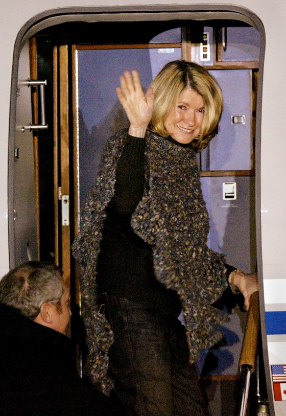 After being released from prison March 4, Martha Stewart waves as she boards her jet at Greenbrier Valley Airport in Lewisburg, W. Va.