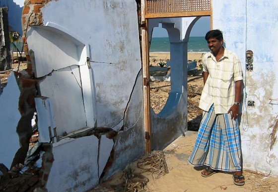 A.L.M. Thaseem stands in what is left of his guest house on the Sri Lankan coast following the Dec. 26 tsunami.