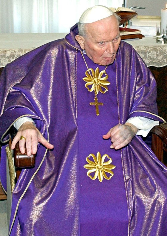 Pope John Paul II celebrates Mass in his 10th-floor room at the Gemelli Polyclinic hospital in Rome Friday.