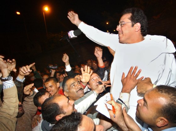 Egyptian opposition leader Ayman Nour greets supporters of the Tomorrow Party in Cairo on Saturday. Nour was subject to a controversial arrest in January on allegations he forged documents to register the party.
