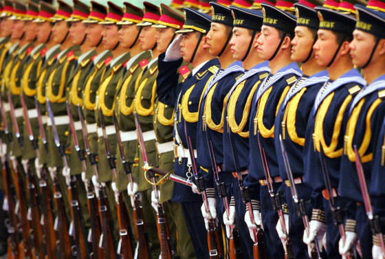 Chinese military honour guards stand in a formation during a ceremony in Beijing