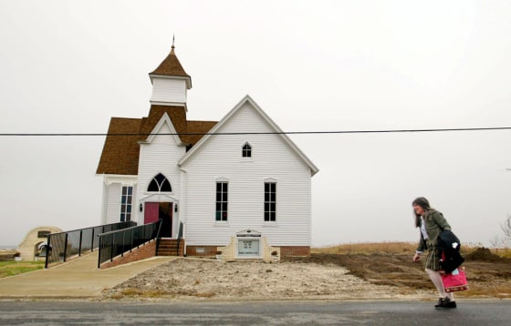 Hoopersville United Methodist Church organist Teena Gorrow walks to services Sunday Nov. 21, 2004. (AP Photo/ Matt Houston)