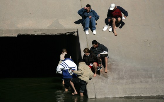 People prepare to cross illegally into the United States through a tunnel along the Rio Grande in the border city of Ciudad Juarez, Mexico, in January. The undocumented U.S. immigrant population surged last year, according to a report released Monday.