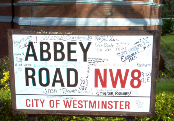 Devoted fans pay their respects to the Beatles by autographing a sign outside the world-famous recording studio.