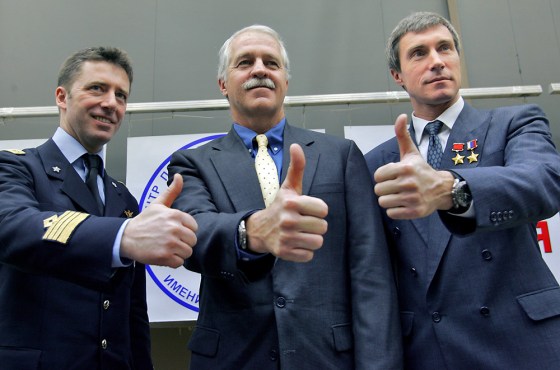 From left: European Space Agency astronaut Roberto Vittori of Italy, NASA astronaut John Phillips of the United States and Russian cosmonaut Sergei Krikalyov give a thumbs up at a news conference at Star City on Tuesday.