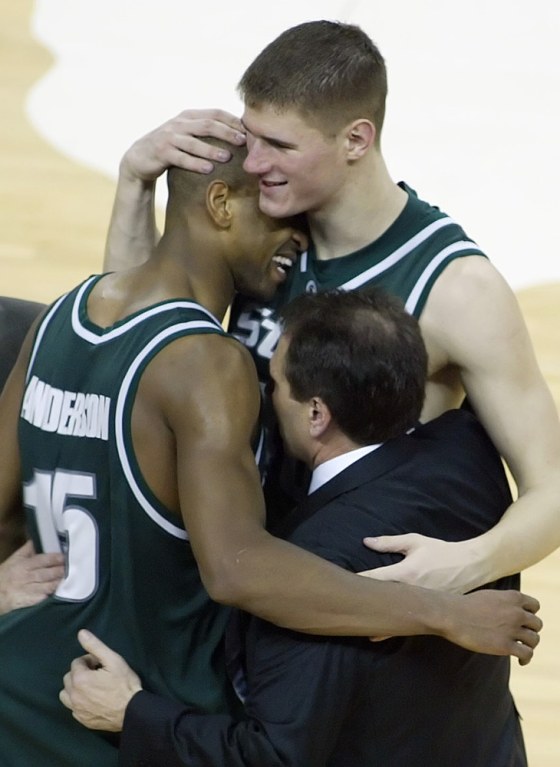Michigan State's&nbsp;Paul Davis, right, shown hugging coach Tom Izzo and teammate Alan Anderson after beating Duke last week, has played with renewed passion this season.