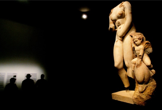 The Venus figure is displayed at the Israel Museum on Wednesday. A winged Eros as a pudgy child riding a dolphin supports the left leg.