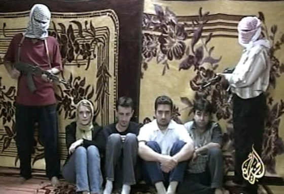 A video grab taken from Al Jazeera which aired a videotape shows three Romanian journalists abducted by an unknown group in Iraq