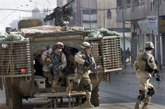 U.S. Army 1st Battalion, 24th Infantry Regiment soldiers emerge from a Stryker combat vehicle during a four-hour running gun battle with insurgents in Mosul, Iraq, on Saturday, Feb. 12.