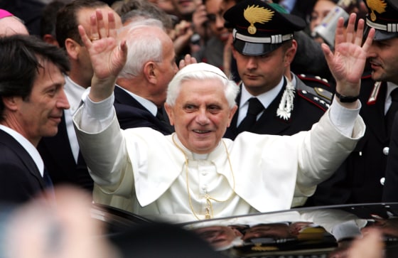 Pope Benedict XVI greets well-wishers in front of his former home in Rome on Wednesday. Liberal and conservative Catholics in the United States are divided over the new pope's orthodox views.