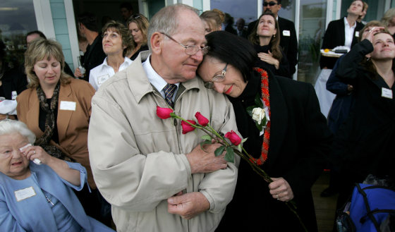 Cliff and Nancy Ruzicka, parents of activist Marla Ruzicka, comfort one another on Saturday during a memorial service for their daughter held in Lakeport, Calif. 