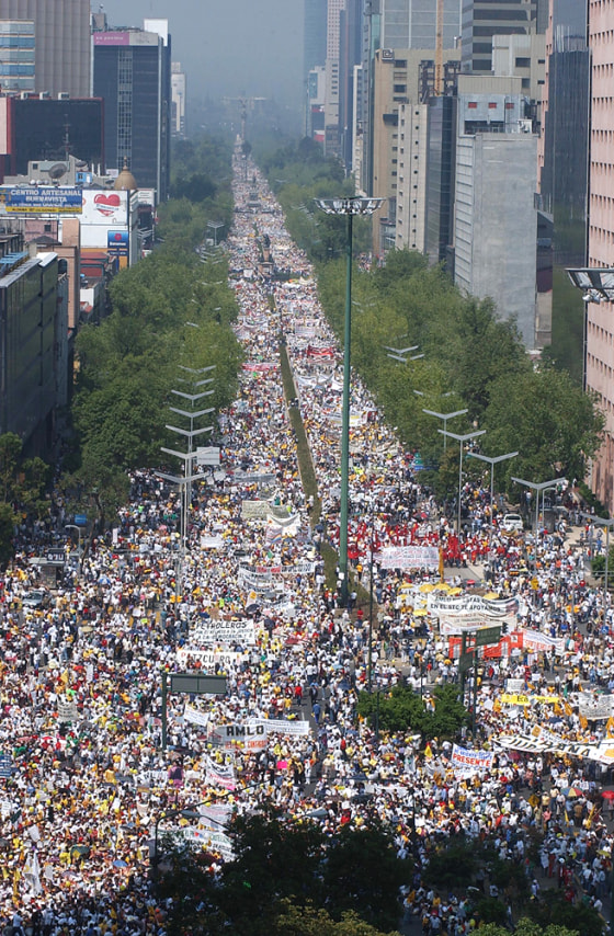 Tens of thousands of people march Sunday in support of Mexico City Mayor Andres Manuel Lopez Obrador.