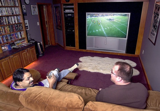 Big picture, big sound, DVD players, and lots of cables -- the living room of today.