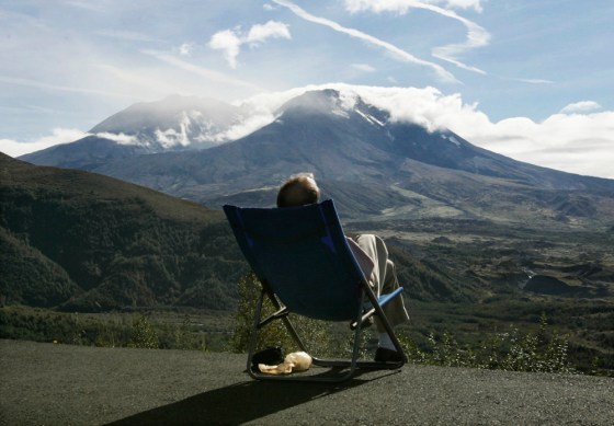 Visitor relaxes in the afternoon sun while watching Mount St. Helens