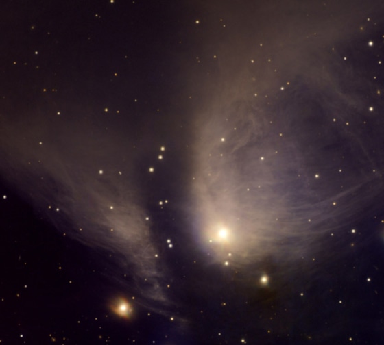 The wispy remains of the gas cloud that formed the bright star at bottom/center in RY Tau. This system is approximately 450 light-years away and spans about 2/3 of a light-year. The central star is a variable star that ranges between visual magnitudes 9 and 11 over an irregular period of time.