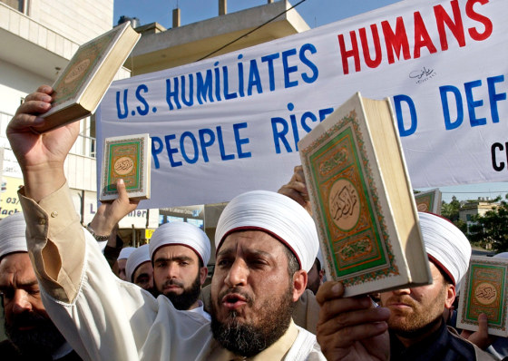 Sunni Muslim clerics hold copies of the Quran, Islam's holy book, during a demonstration in front of the U.S. Embassy in Aukar, on the outskirts of Beirut, on Friday.