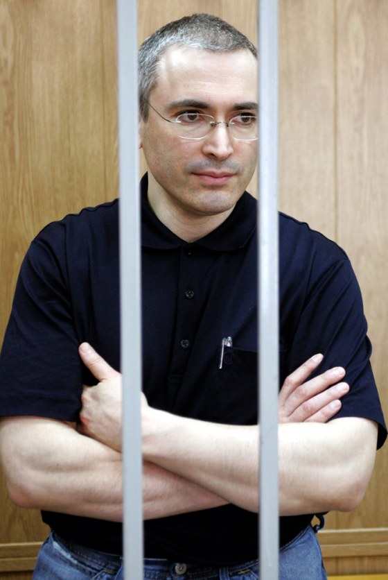 File photo of oil tycoon Khodorkovsky stands in the cage inside a Moscow court