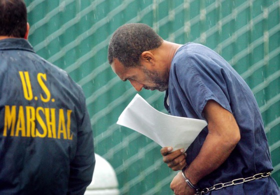 Physician Rafiq Abdus Sabir is accompanied by U.S marshal agents as he leaves at the courthouse of Fort Pierce
