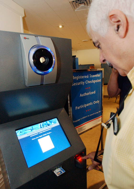Armen Derhohannesian, of Hampton, N.H., verifies his fingerprint at the American Airlines terminal at Logan Airport in Boston during a pilot program allowing frequent fliers to cut down their boarding times.