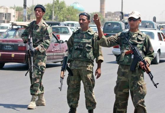 Iraqi soldiers man a checkpoint during Operation Lightning in Baghdad