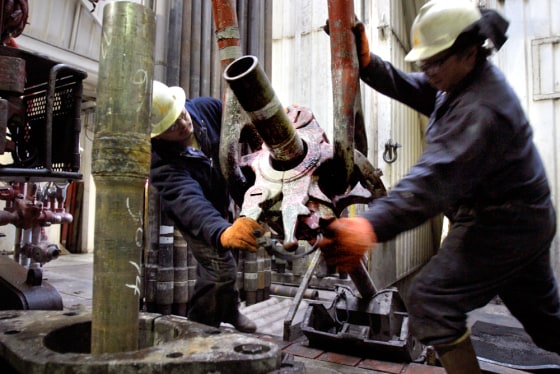 Walter Williams, left, and Gary Stevens work at the BP Prudhoe Bay oil field facility in Alaska's Northslope.
