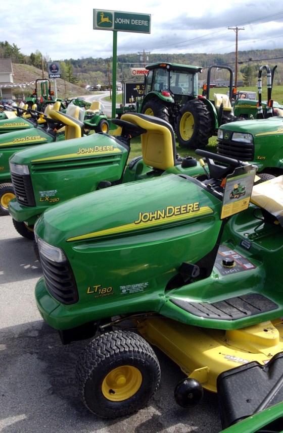 Lawn and farm tractors sit on the lot of Twin Cities Equipment in Montpelier, Vt., last month. Deere & Co.'s commercial and consumer equipment sales fell 6 percent to $1.23 billion in the second quarter. 