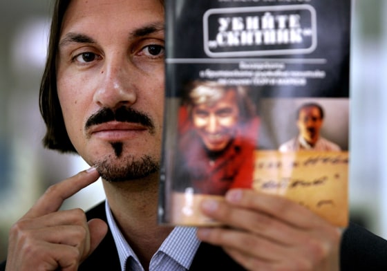 Bulgarian journalist Hristo Hristov shows his book \"Kill the Tramp\" in Sofia