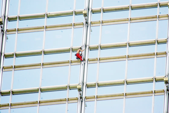French free climber Alain Robert climbs