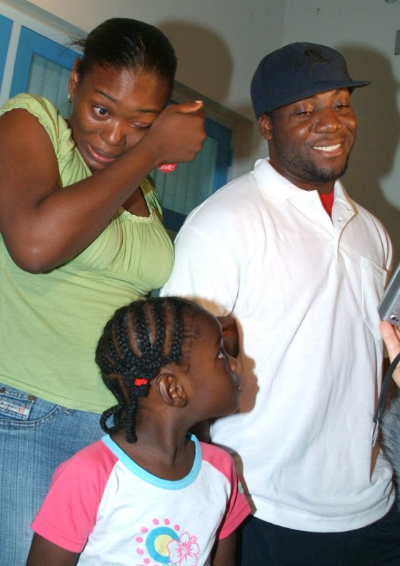 Abraham Jones, 28, right, stands with his wife Cynthia and daughter Kiana after being released from the police station in Noord, Aruba, on Monday.