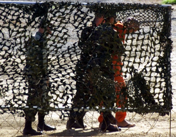 File photo of US Marines escorting a new detainee at Guantanamo Naval Base in Cuba