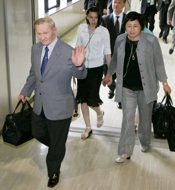 Charles Jenkins, his wife, Hitomi, and their daughters board a plane at Narita International Airport in Tokyo on Tuesday for the flights to Washington and North Carolina.