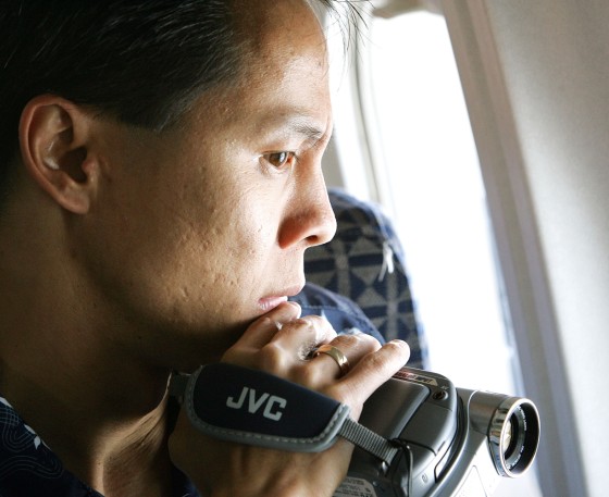 Richard Silver of Sherwood, Ore., one of the Vietnamese orphans adopted during "Operation Babylift" 30 years ago, looks out the window as the aircraft begins its final approach to Ho Chi Minh City in Vietnam on Wednesday.