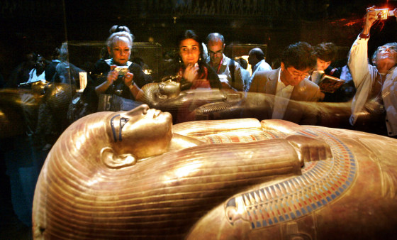 Visitors view the "Gilded Coffin of Tjuya" at the "Tutankhamun and the Golden Age of the Pharaohs' exhibition Wednesday at the Los Angeles County Museum of Art ahead of its official public debut.