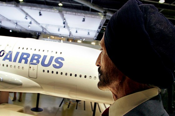 A man looks at a cabin mock-up of Airbus A380 at the Paris Air Show at le Bourget