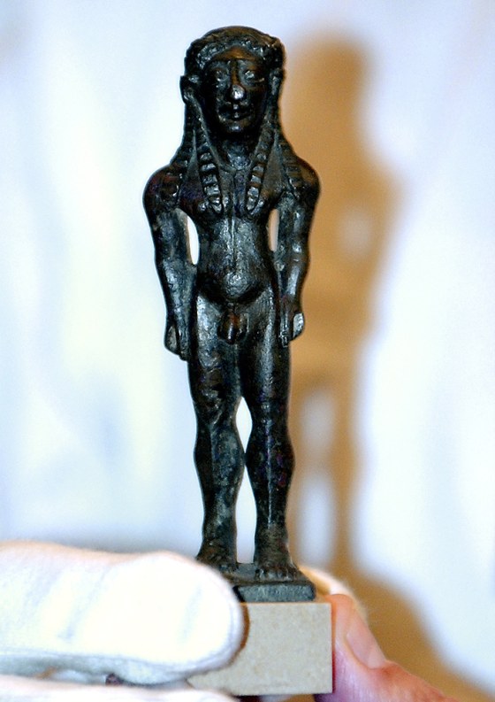 A 2,600-year-old bronze statuette of a youth is displayed at the Culture Ministry in Athens on Thursday. A British ancient art dealer returned the tiny 2,600-year-old statue to Greek authorities, after realizing the piece had been stolen from the island of Samos during World War II.