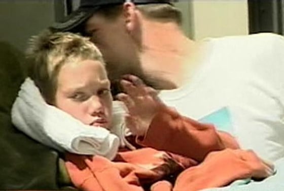 Brennan Hawkins waves as he is taken from an ambulance that transported him to a hospital in Salt Lake City. The 11-year-old boy was dehydrated and hungry after being lost in the wilderness for four days, but in otherwise fine condition.