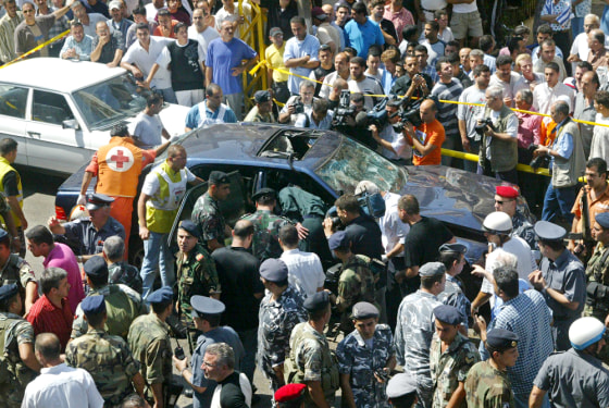 The damaged car of George Hawi, the former leader of the Lebanese Communist Party, is seen after a blast in Beirut