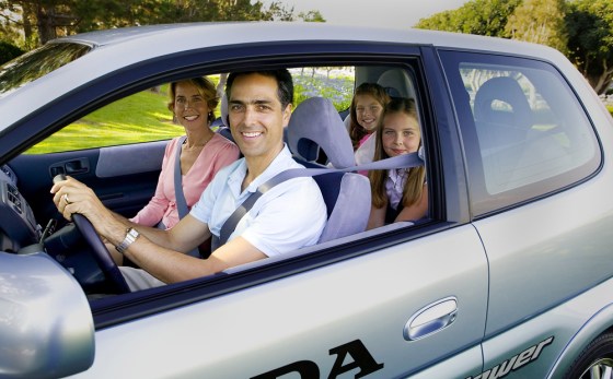 Jon and Sandy Spallino, and their two daughters, pose with their leased Honda fuel cell vehicle on Wednesday.