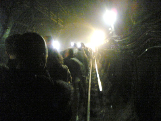 Passengers evacuate a subway train in a tunnel near King's Cross station in central London on Thursday in this image taken by commuter Alexander Chadwick's cell phone camera.