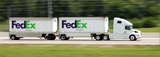A FedEx Ground truck heads east on Interstate 24 in Nashville, Tenn. earlier this month. FedEx Ground drivers contend in a federal lawsuit they should be employees rather than independent contractors, a move that could cost the company millions.