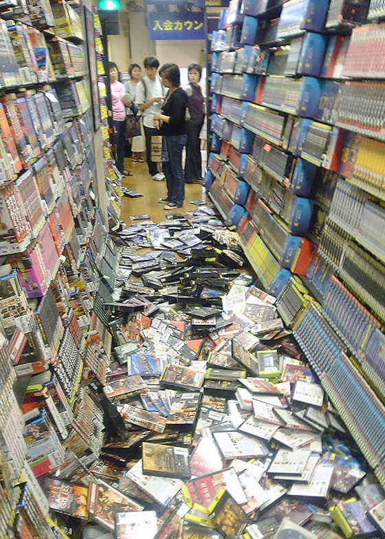 Packages of DVDs litter the floor at a video shop in Tokyo after a strong earthquake rocked the capital Tokyo and its vicinity on Saturday.