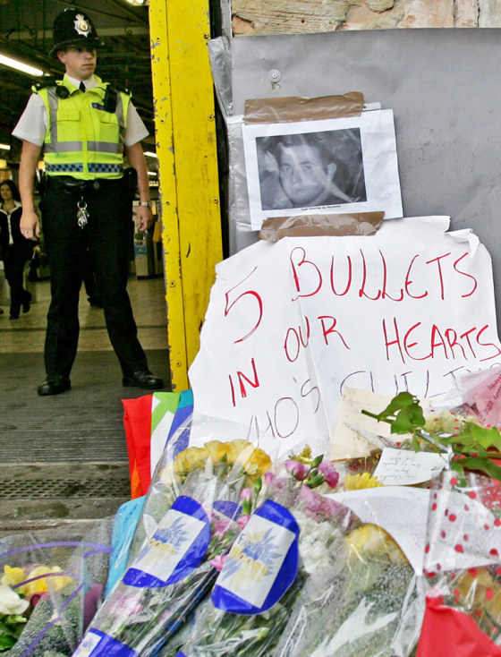 A British police officer stands outside Stockwell Underground station in south London